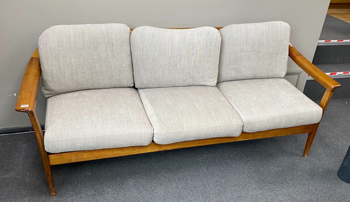 A mid century Wilhelm Knoll cherry three seater settee with loose cushion seats and backs, width 189cm, depth 75cm, height 75cm